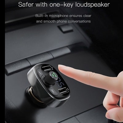 A finger pointing at the BASEUS Wireless Bluetooth FM Transmitter & MP3 Music Player with Dual USB Car Charger, highlighting its built-in microphone for one-key loudspeaker functionality and superior phone conversation clarity.