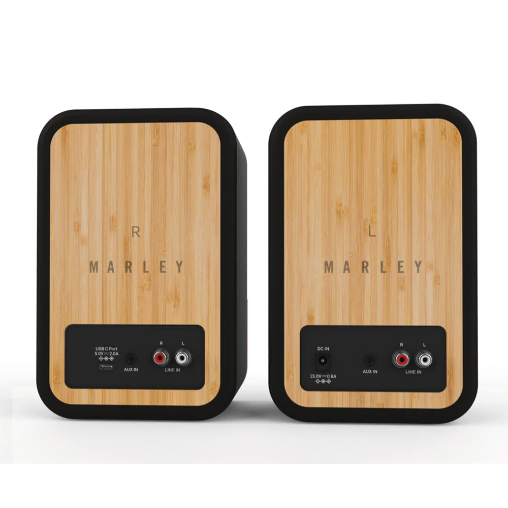 Rear view of two MARLEY House of Marley Get Together Duo Bluetooth speakers with bamboo panels, labeled "R" and "L," displaying input ports, power connections, and the brand name on both speakers.