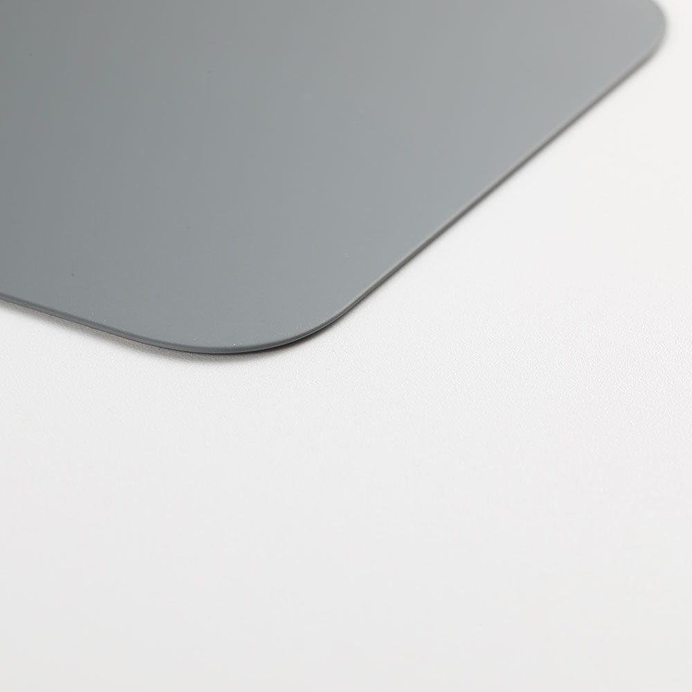 Close-up of the Cirrus-link Back Glass Cover with Big Camera slot for iPhone 12 PRO (AfterMarket) in gray, shown on a white surface.