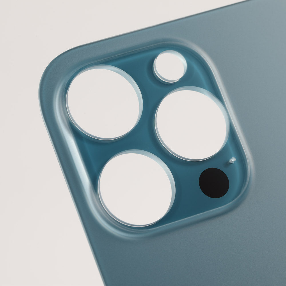Close-up of the Cirrus-link Back Glass Cover with Big Camera slot for iPhone 12 PRO MAX (AfterMarket), featuring four empty cutouts, including a large camera hole on the back.