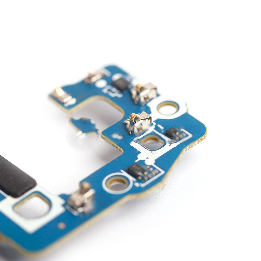 Close-up view of a blue circuit board with various electronic components, including capacitors and connectors, against a white background, showcasing OG's OEM quality craftsmanship suitable for the Charging Port Flex Cable for Samsung Galaxy S9 (G960U) replacement.