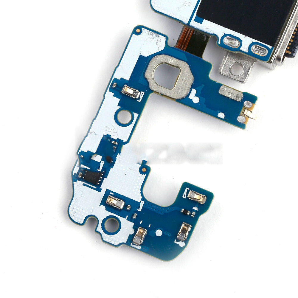 Close-up of a blue printed circuit board on a white background, featuring various electronic components and connectors, including an OG Charging Port Flex Cable for the Samsung Galaxy S9 Plus.