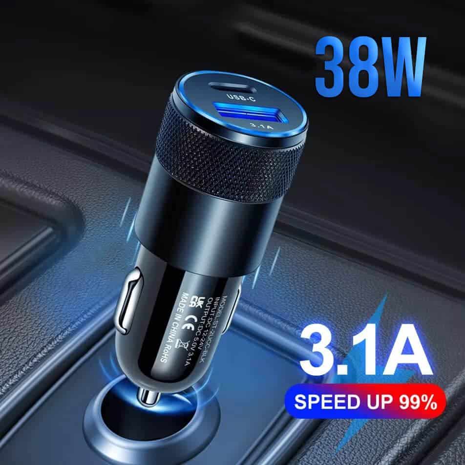 A close-up of the SMART KOALA 38W Dual Port PD & 3.1A USB Fast Car Charger Socket Adapter by Smart Koala, plugged into a car's 12V socket. Text on the image reads "38W, 3.1A, SPEED UP 99%".