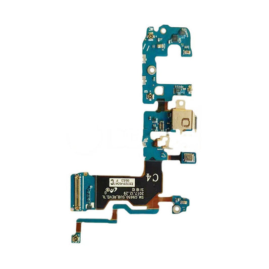 Close-up view of an electronic circuit board with various components, including connectors and chips, attached to a blue substrate. Notably, the OG Charging Port Flex Cable For Samsung Galaxy S9 Plus (G9650) is visible alongside the charging port connection.