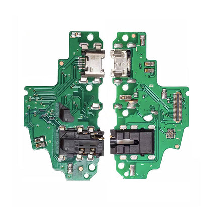 Close-up of a green printed circuit board with various electronic components and connectors, including a micro-USB port, chip, and connectors, split into two parts. This **Dr.Parts Charging Port Board Replacement for Huawei P Smart (2018)** ensures efficient charging and data transfer for your device.