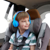 A young boy smiling while wearing Blue BELKIN SoundForm Mini Wireless - On-Ear Headphones for Kids in a car seat.