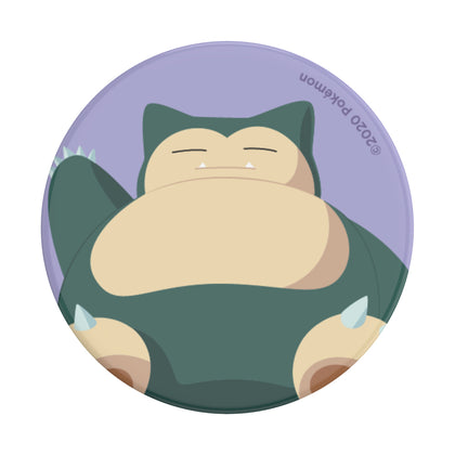 Round sticker design featuring an illustration of a sleeping Snorlax Pokémon with swappable PopSockets PopGrip Licensed - Snorlax Knocked.