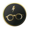 Black and gold emblem PopSockets PopGrip Licensed - Harry Potter featuring a lightning bolt and round glasses, designed with swappable PopTops for wireless charging compatibility.