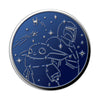A circular metallic badge featuring an embossed design of a spaceship and celestial elements, swap PopGrip Licensed - Enamel Mandalorian on a blue background, wireless charging compatible from POPSOCKETS.