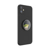 Black smartphone with a circular POPSOCKETS PopGrip Licensed - Star Wars Mandalorian Grogu Force featuring a swappable PopTop with a cartoon character on the back.