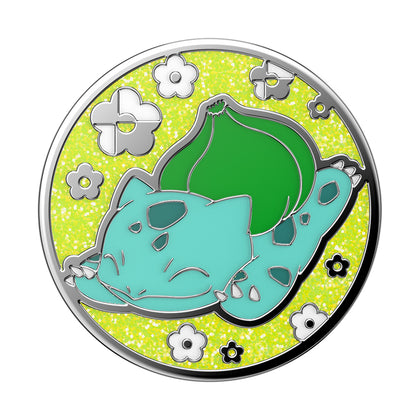Illustration of a stylized turquoise cat lying down among flowers on a yellow background, encircled by a silver border, featuring swappable POPSOCKETS PopGrip Licensed - Bulbasaur Nap.