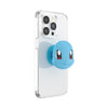 An animated character resembling Squirtle peeking out from behind a transparent phone case with a POPSOCKETS PopGrip Licensed (Gen2) - Popout Squirtle Face accessory.