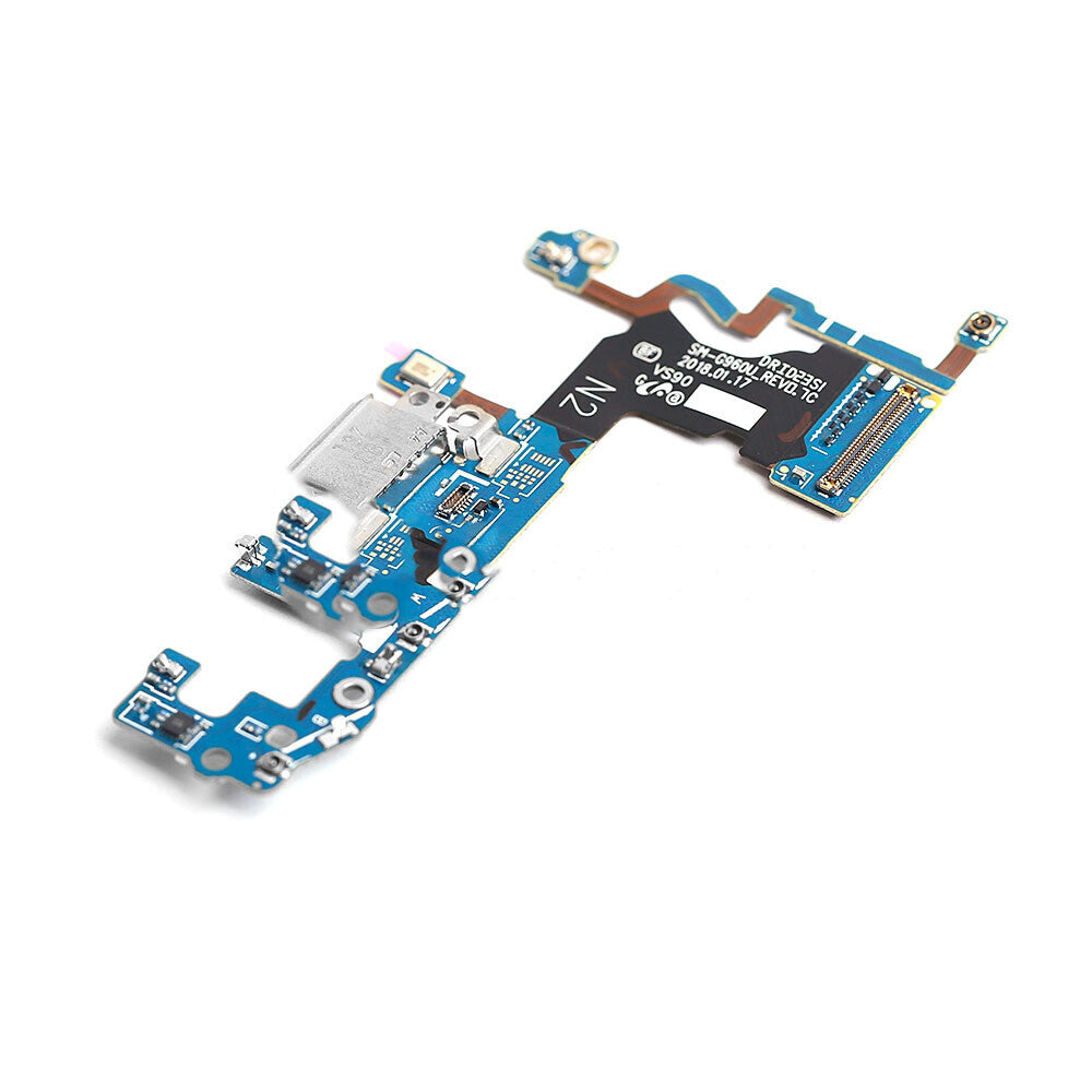 A close-up of an OEM quality blue and black electronic circuit board with various components and connectors. The Charging Port Flex Cable For Samsung Galaxy S9 (G960U) by OG, ideal for flex cable replacement, is isolated on a white background.