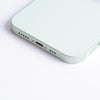 A close up of an Apple iPhone 12 Back Cover Housing Frame on a white surface.